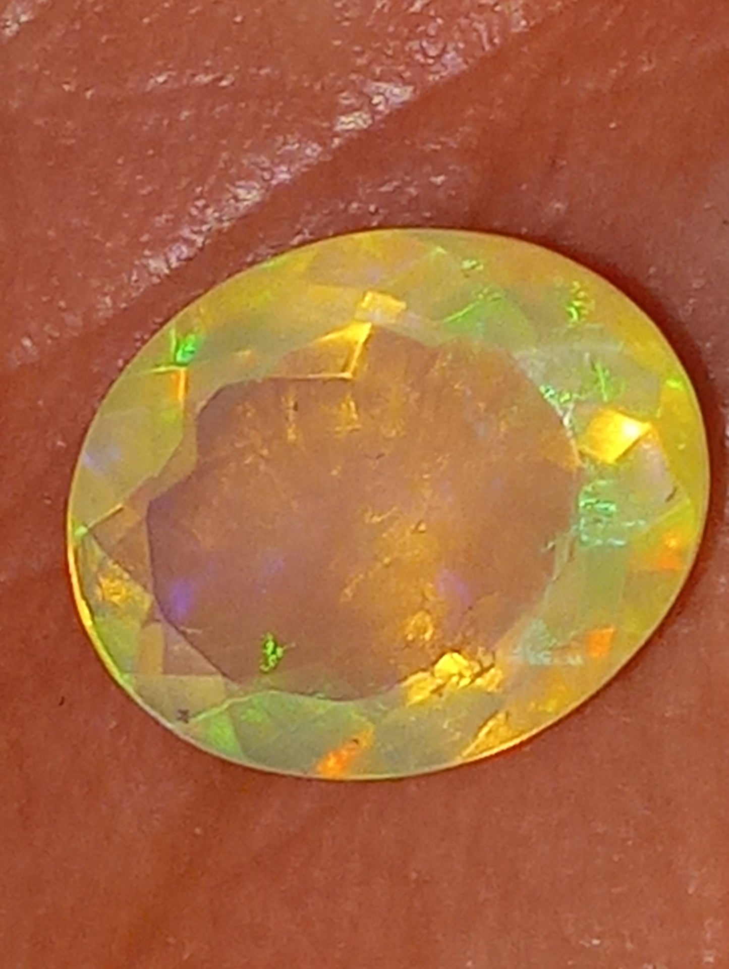 opal gemstone Ethiopian, faceted, 10mmx8mm oval cut, 1.71ct
