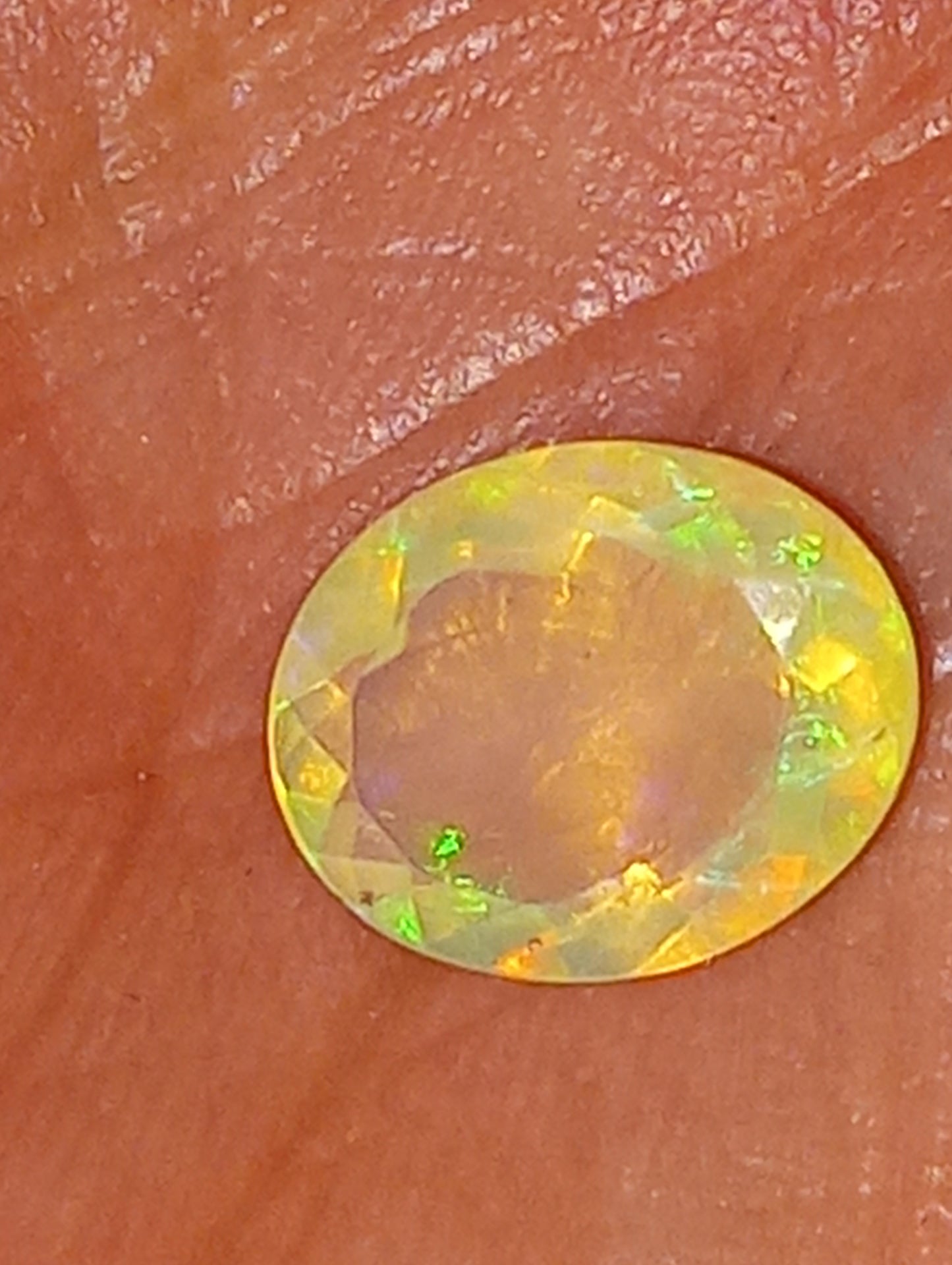 opal gemstone Ethiopian, faceted, 10mmx8mm oval cut, 1.71ct