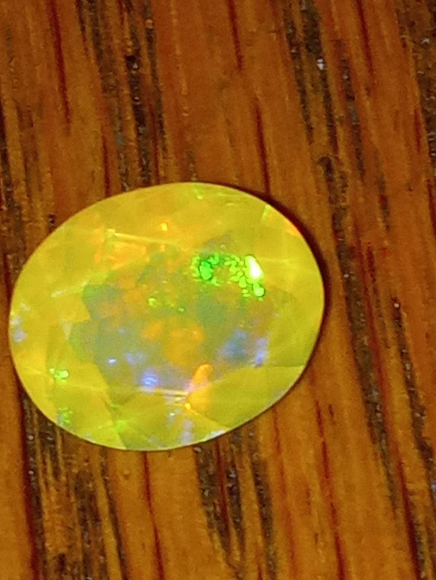 opal gemstone Ethiopian, faceted, 11mmx9mm oval cut, 2.27ct