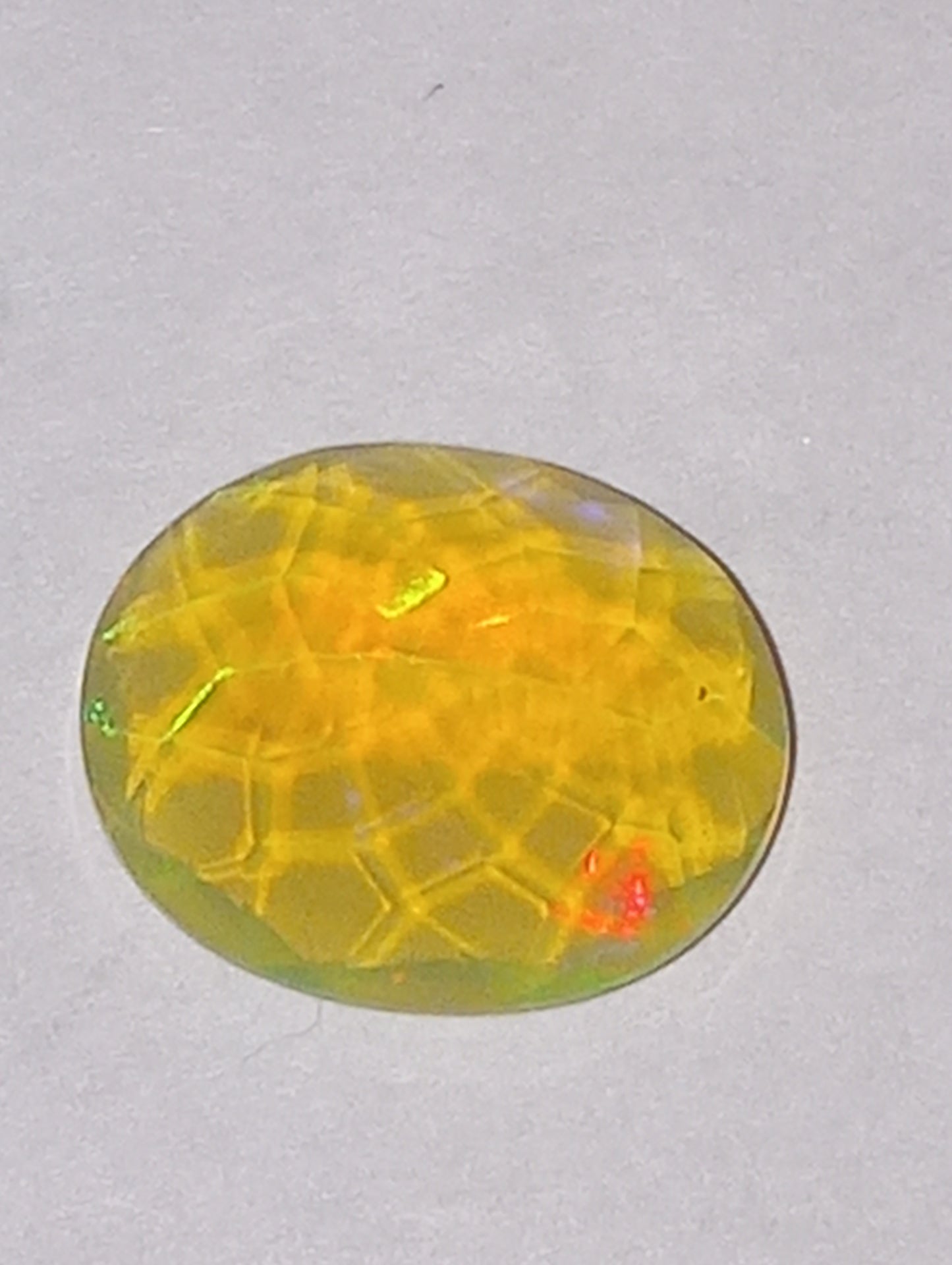 opal gemstone Ethiopian, faceted, 11mmx9mm oval cut, 2.27ct