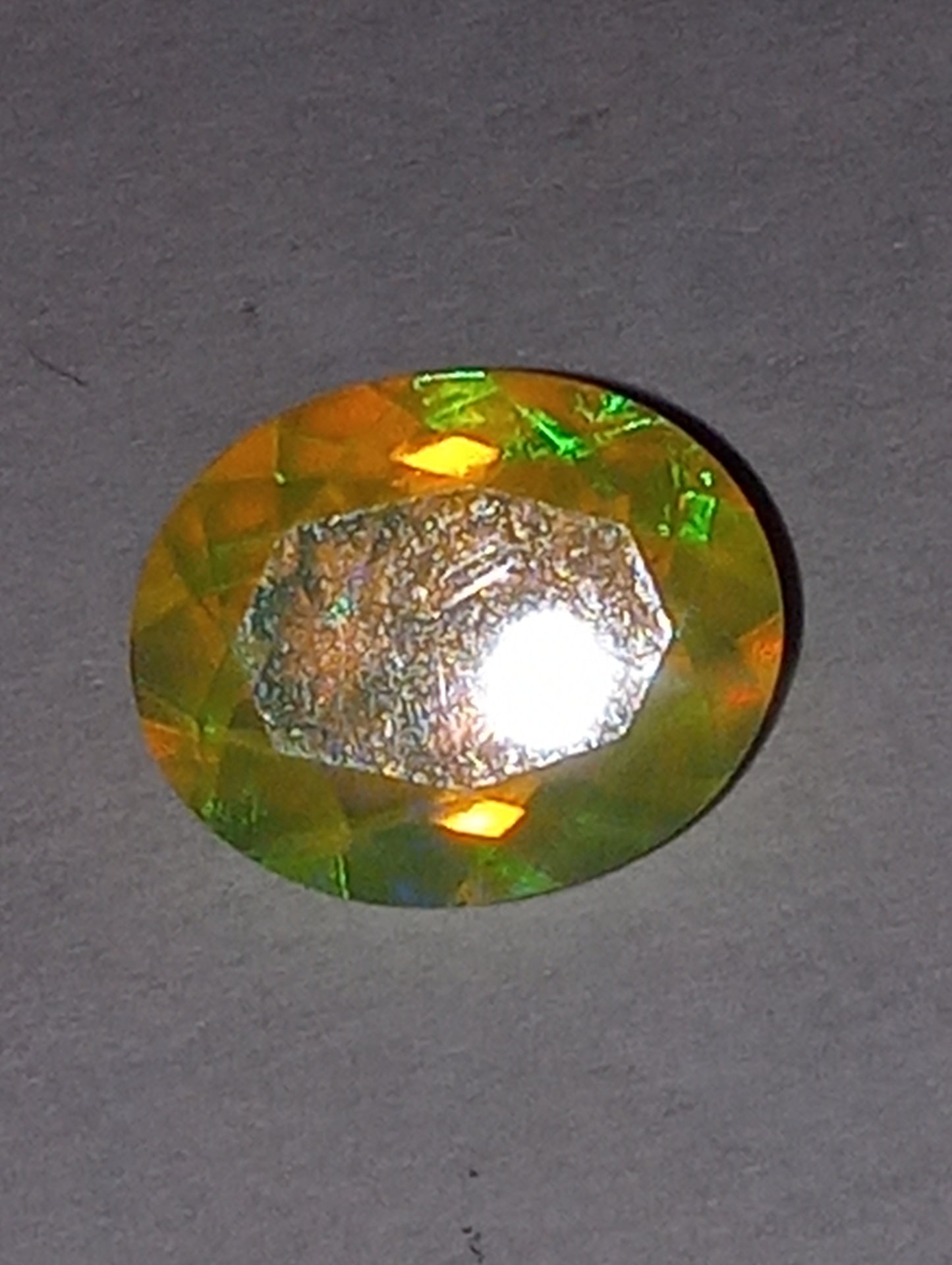 opal gemstone Ethiopian, faceted, 11mmx9mm oval cut, 2.27ct