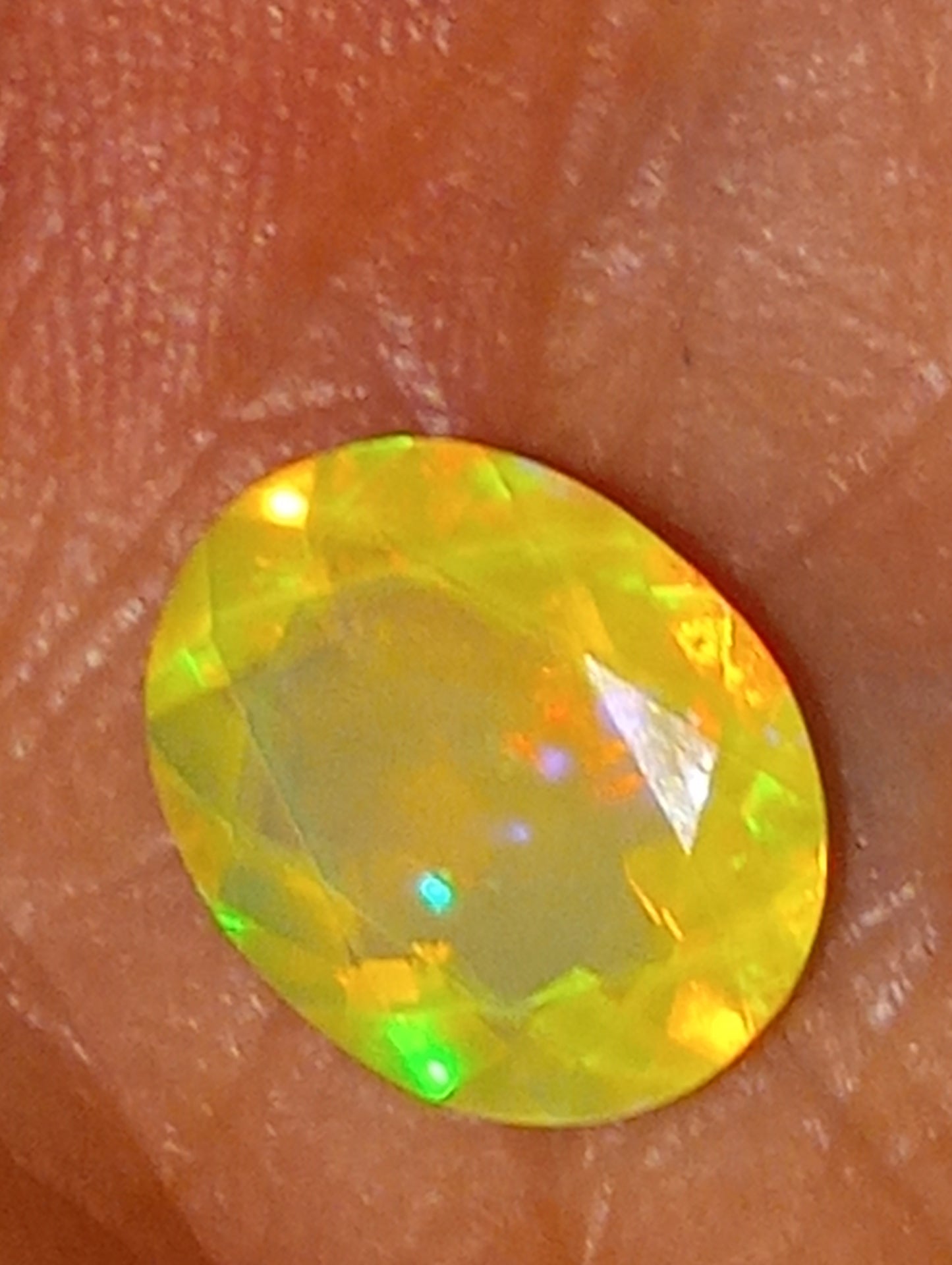 opal gemstone Ethiopian, faceted, 11mmx9mm oval cut, 2.27ct