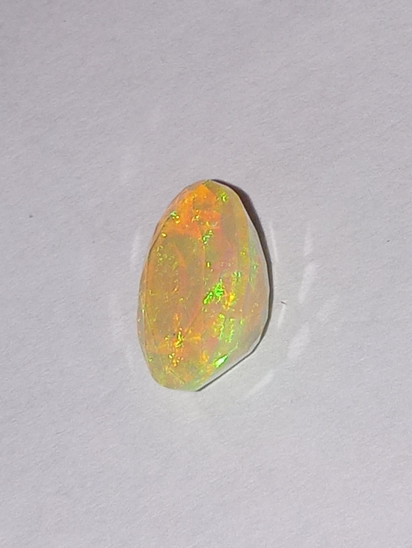opal gemstone Ethiopian, faceted, 11mmx9mm oval cut, 1.94ct
