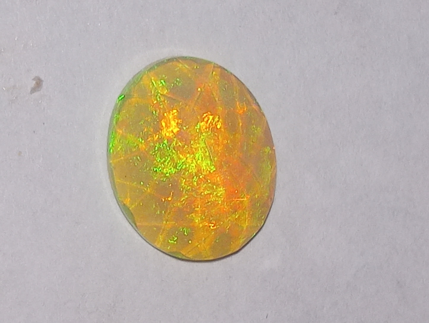 opal gemstone Ethiopian, faceted, 11mmx9mm oval cut, 1.94ct