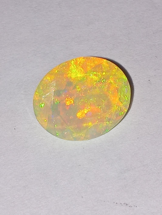 opal gemstone Ethiopian, faceted, 11mmx9mm oval cut, 1.94ct