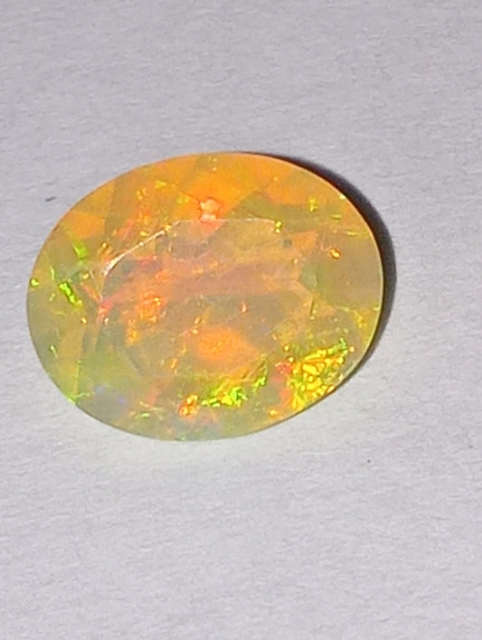 opal gemstone, Ethiopian, faceted, 9mmx7mm oval cut, 1.03ct