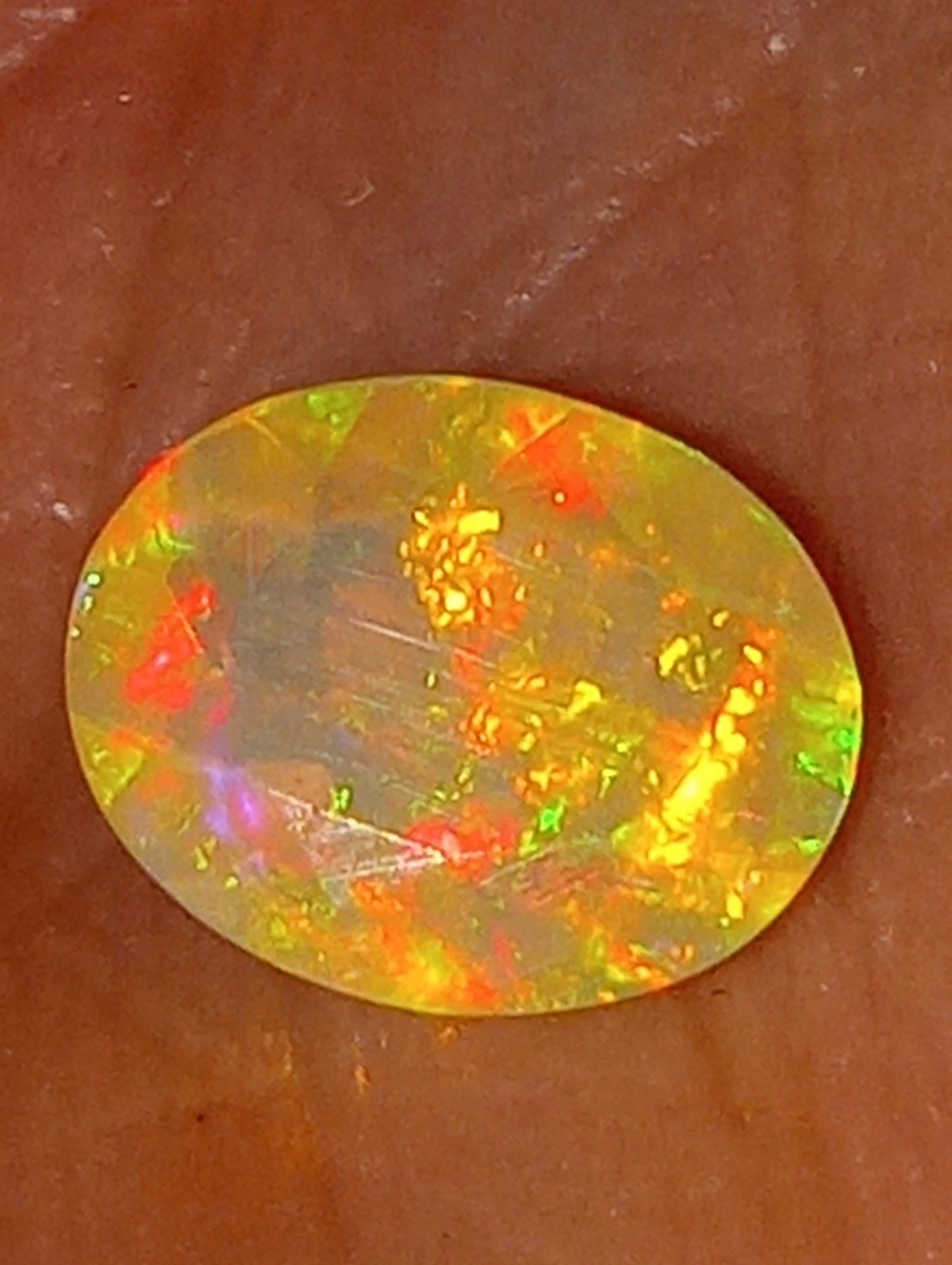 opal gemstone, Ethiopian, faceted, 9mmx7mm oval cut, 1.03ct