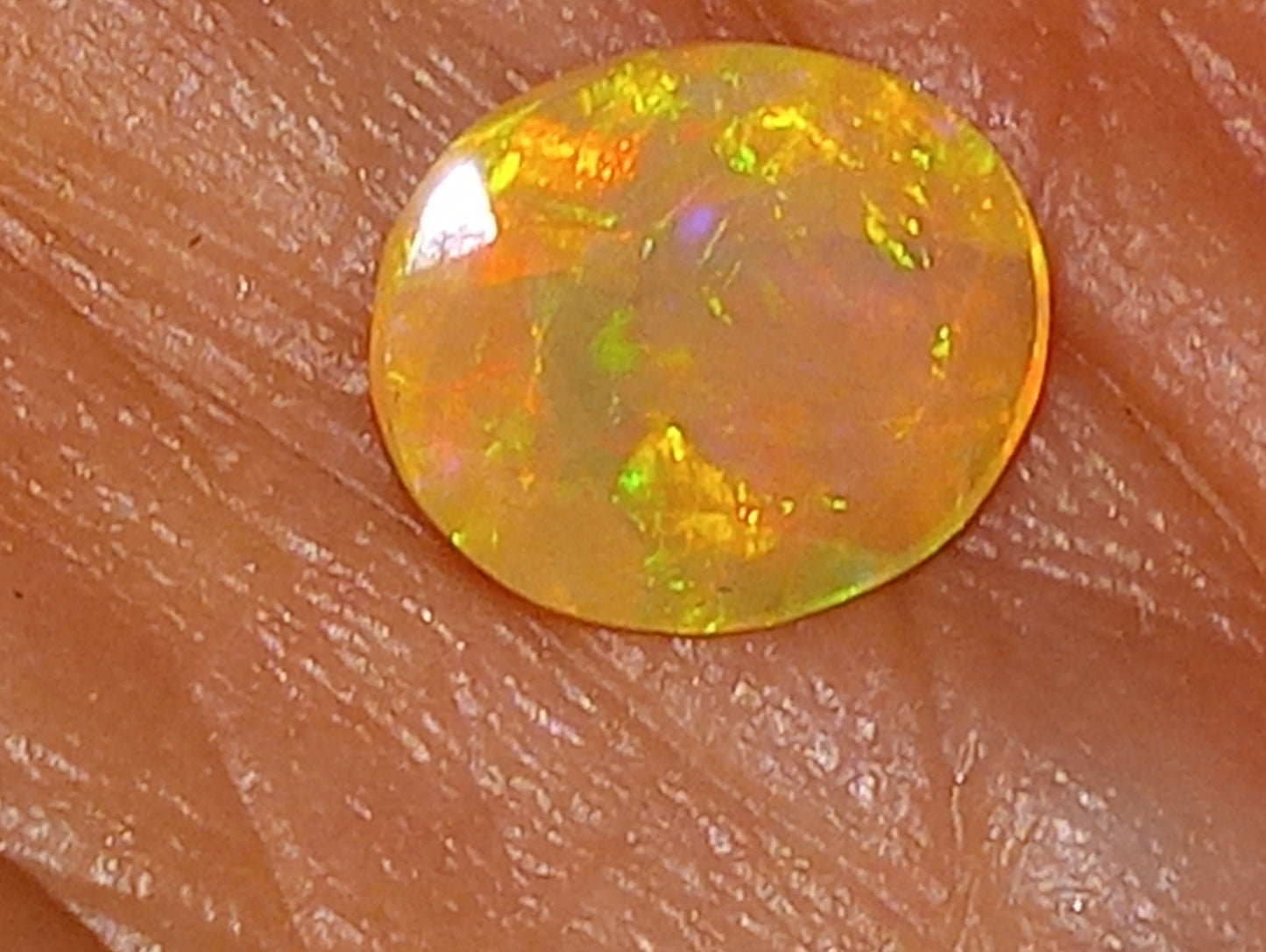 opal gemstone, Ethiopian, faceted, 9mmx7mm oval cut, 1.03ct