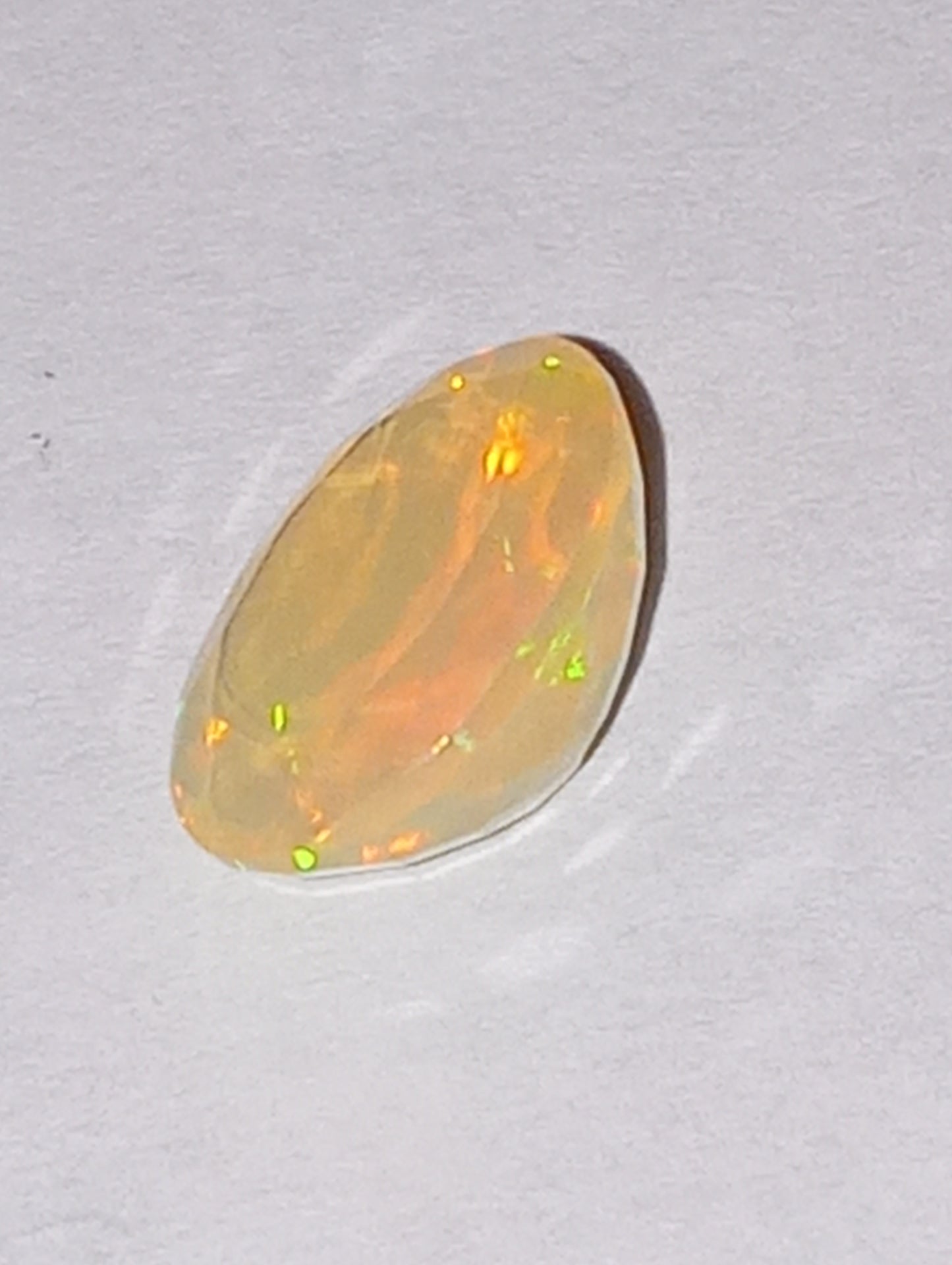 opal gemstone Ethiopian, faceted, 10mm x8mm oval, 1.53ct