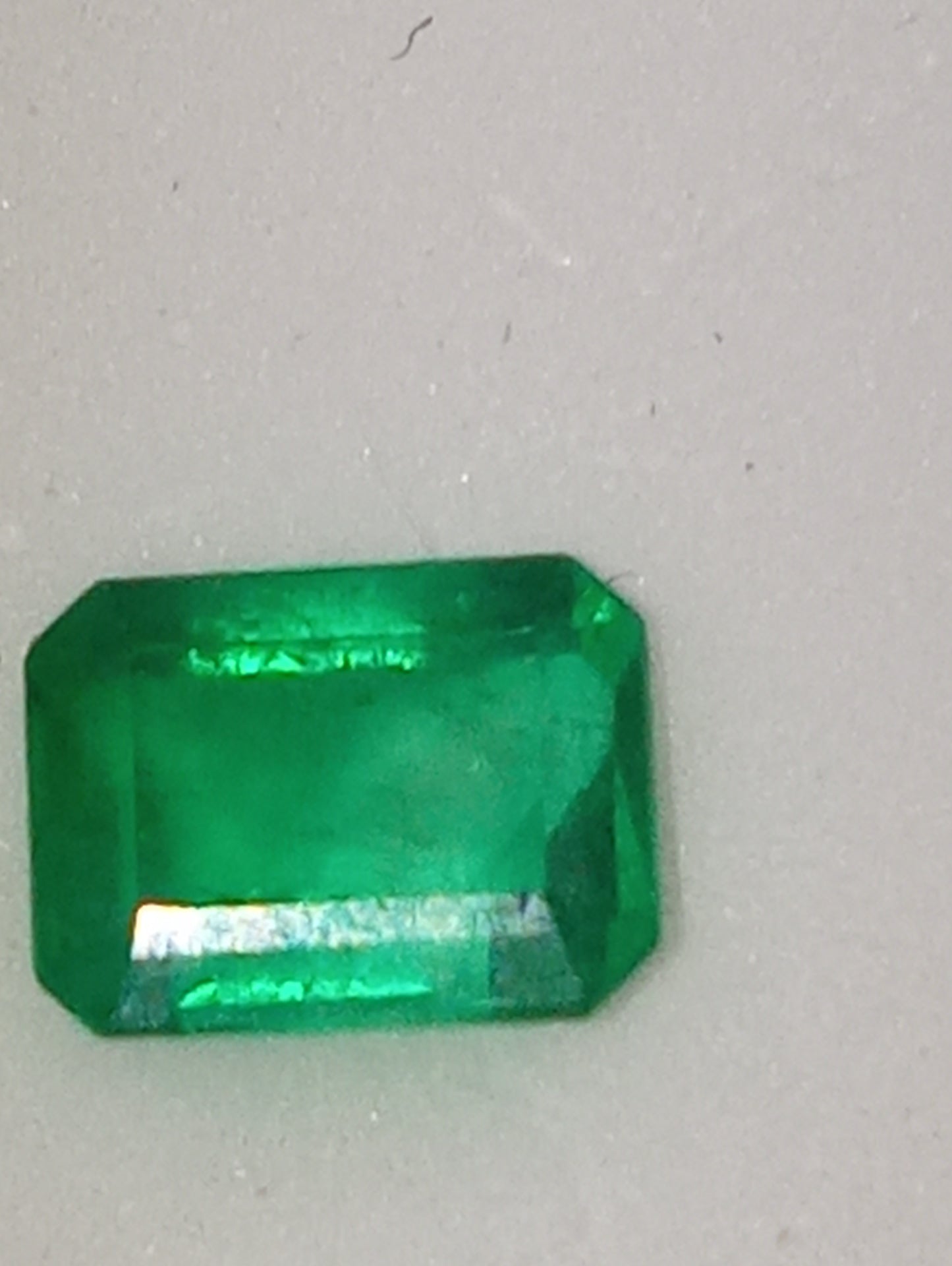 emeraqld gemstone Colombian, 6.5mmx5mm emerald cut, .86ct