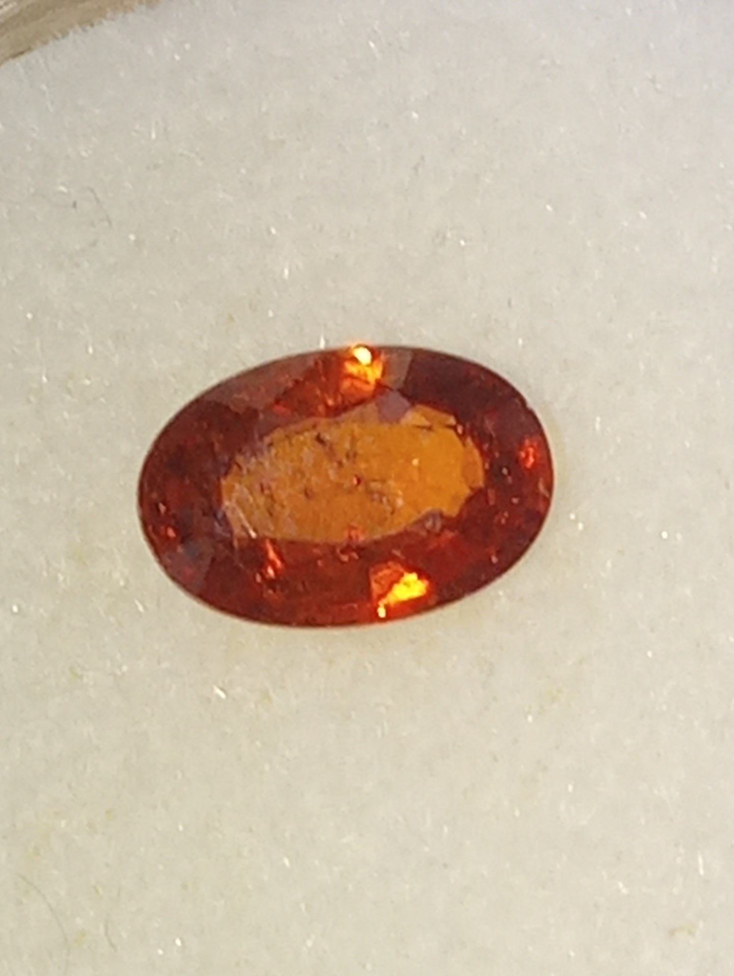 garnet gemstone Spessartite, 6mm x4mm oval cut, .62ct