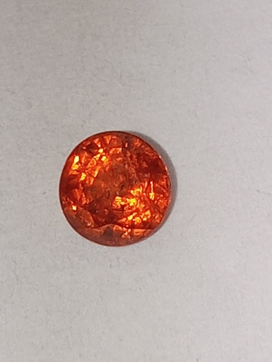 garnet gemstone Mandarin spessartite, 5mm round cut, .68ct