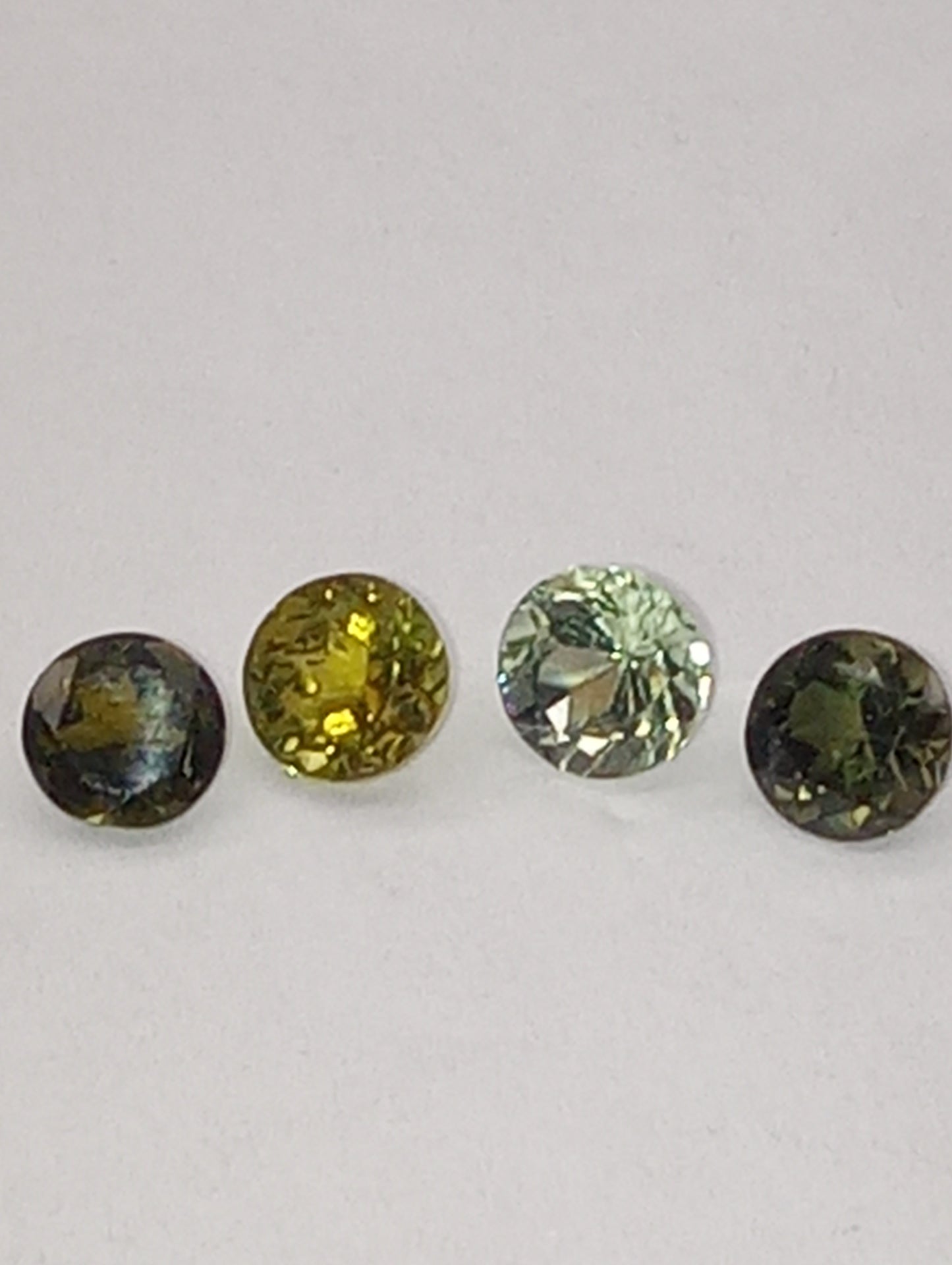 tourmaline gemstones, green shades, 5mm round cuts, 4 stones, 2.20ctw