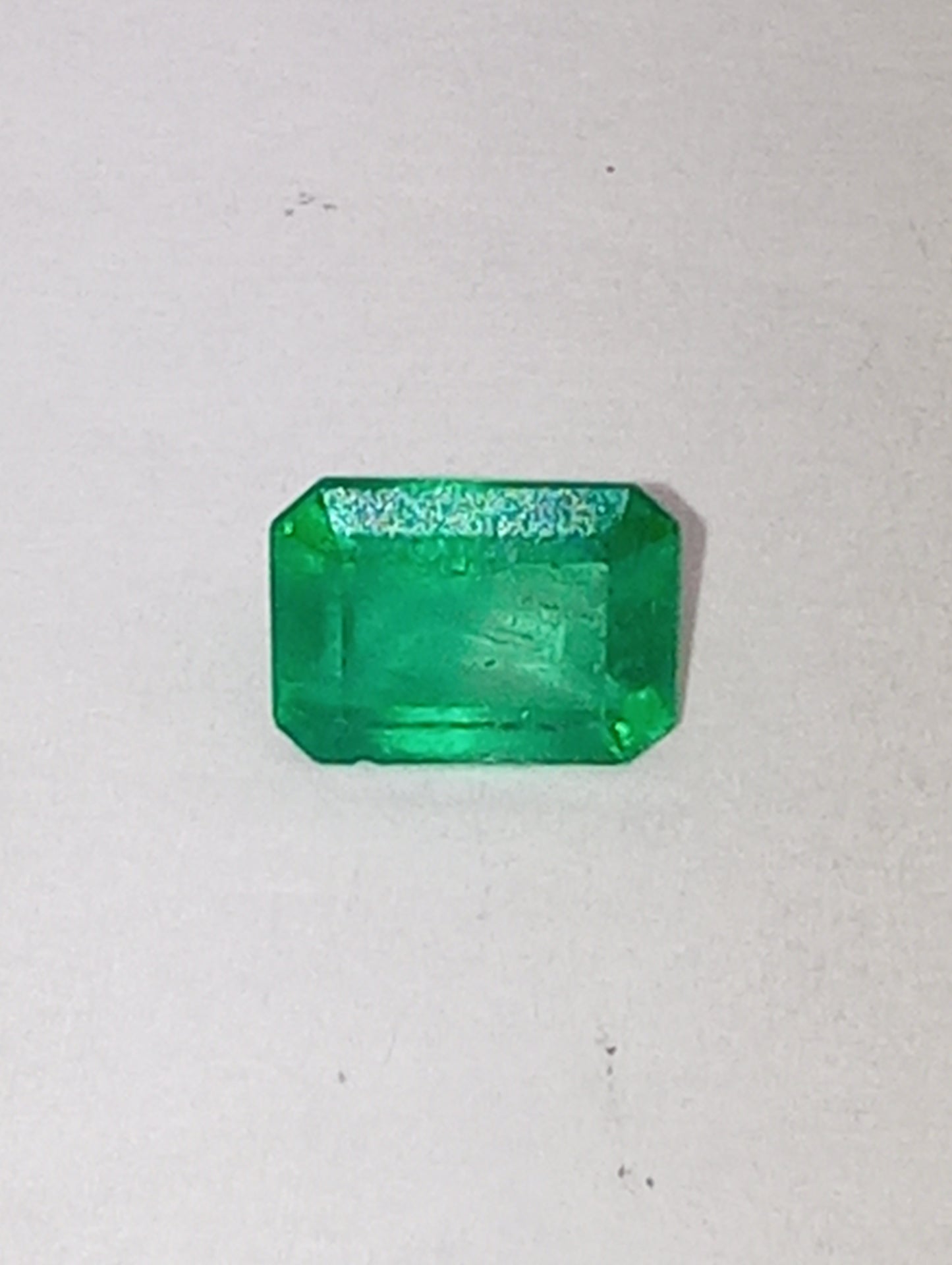 emeraqld gemstone Colombian, 6.5mmx5mm emerald cut, .86ct