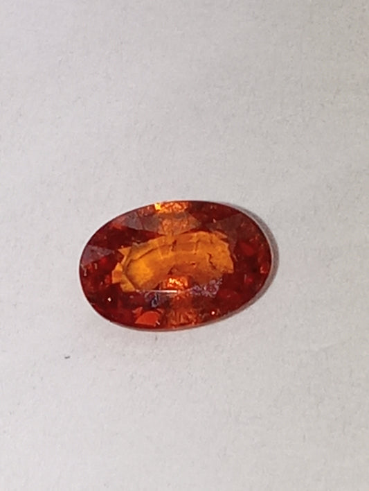 garnet gemstone Spessartite, 6mm x4mm oval cut, .62ct