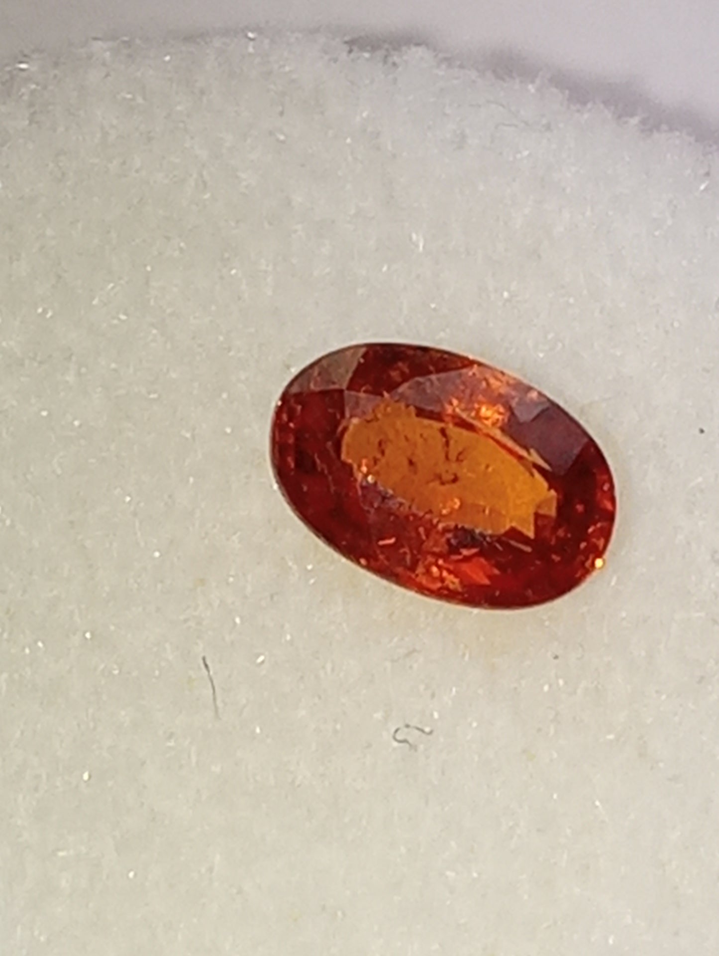 garnet gemstone Spessartite, 6mm x4mm oval cut, .62ct