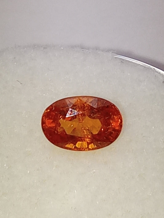 garnet gemstone spessartite, 6mmx4mm oval cut, .70ct