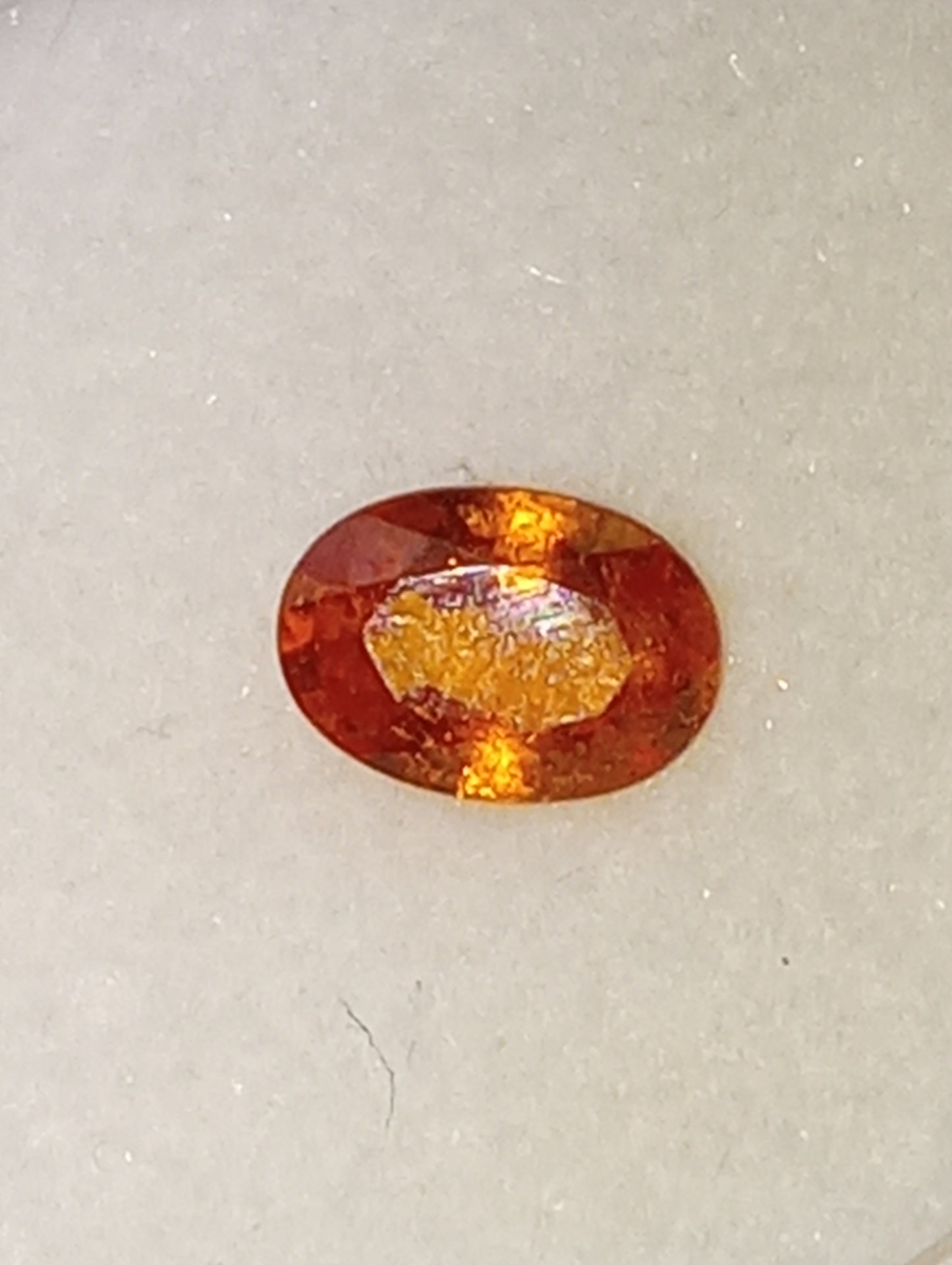 garnet gemstone mandarin spessartite, 6mmx4mm oval cut, .60ct