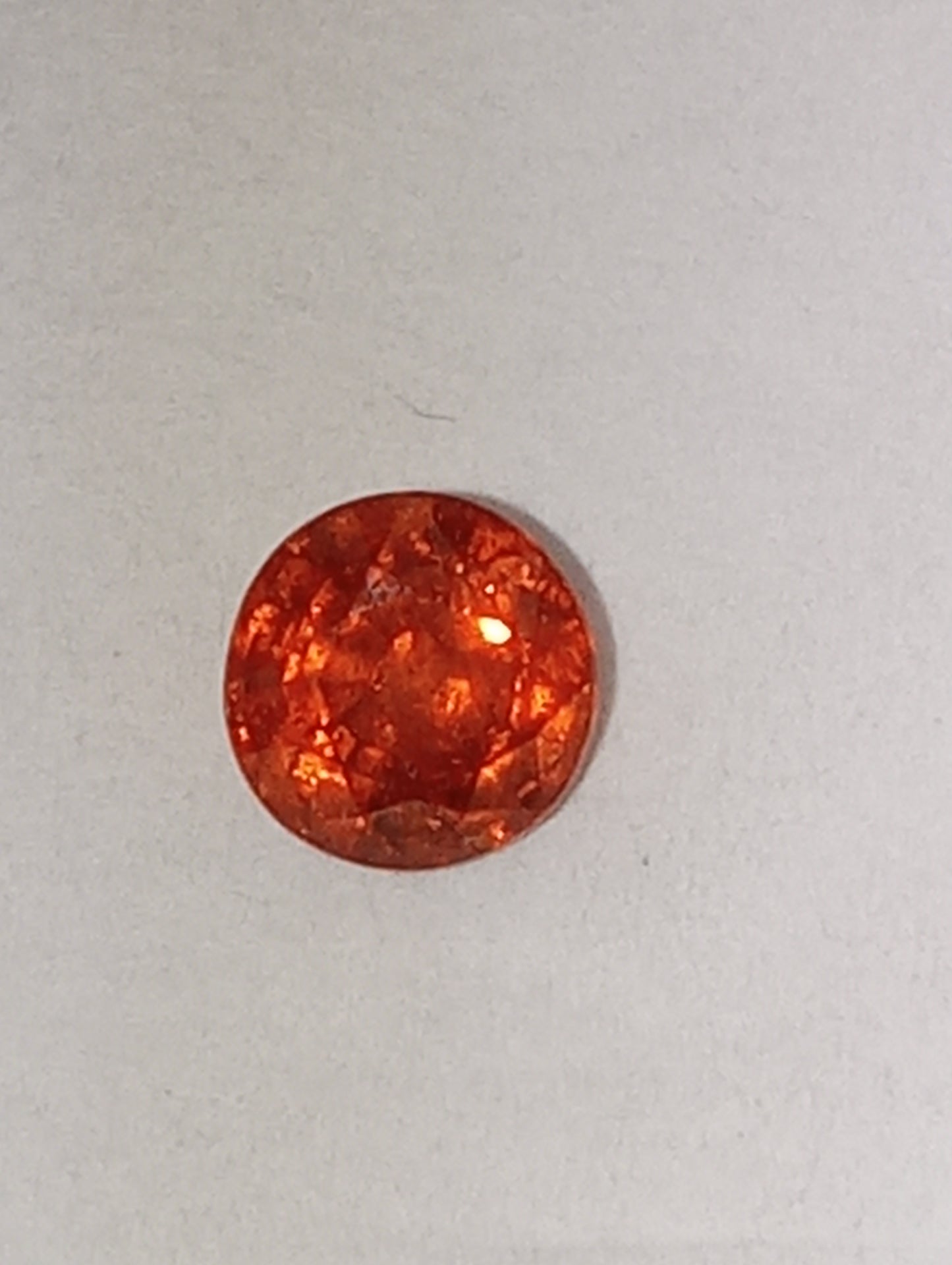 garnet gemstone Mandarin spessartite, 5mm round cut, .68ct