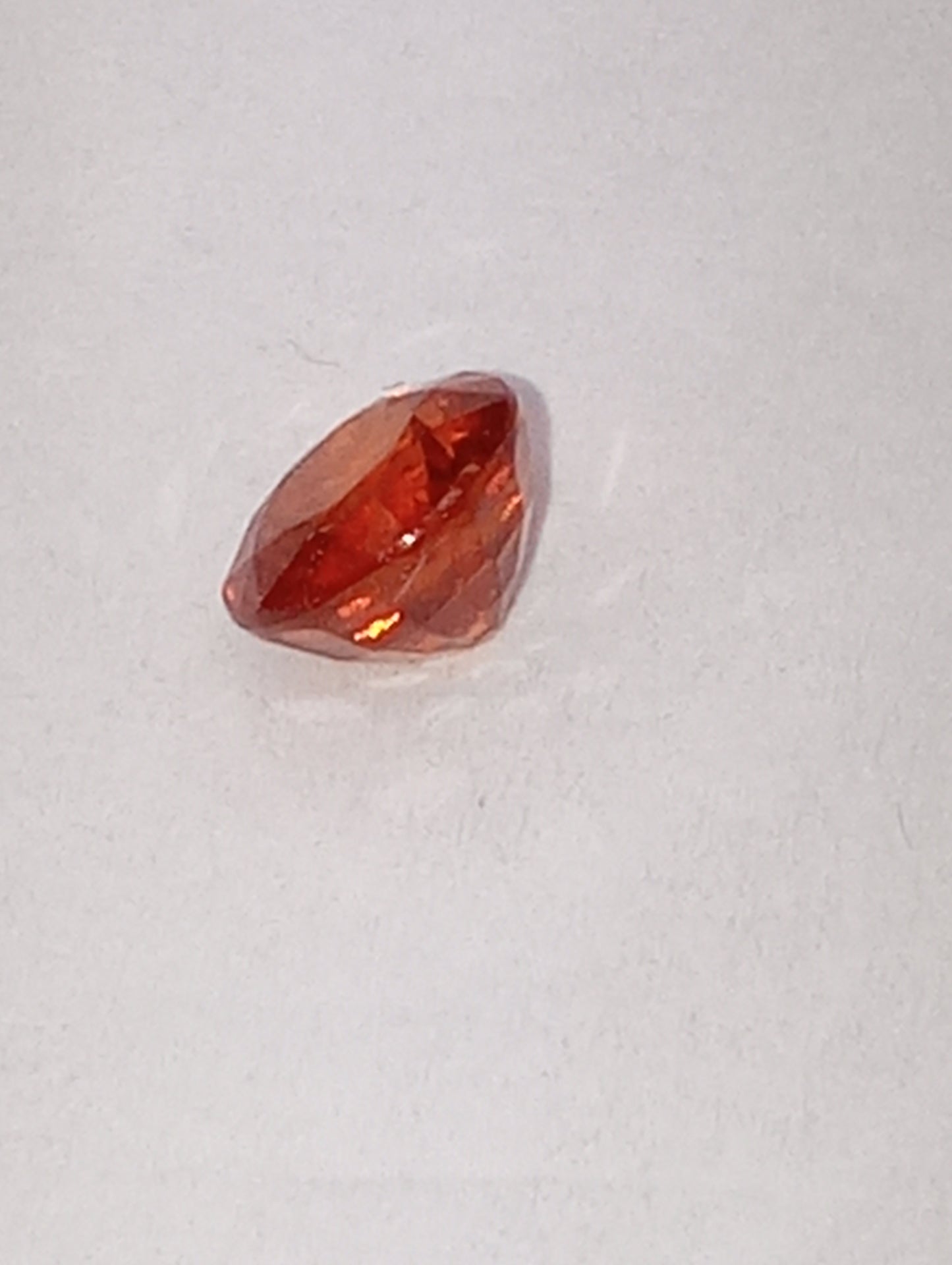 garnet gemstone Mandarin spessartite, 5mm round cut, .68ct