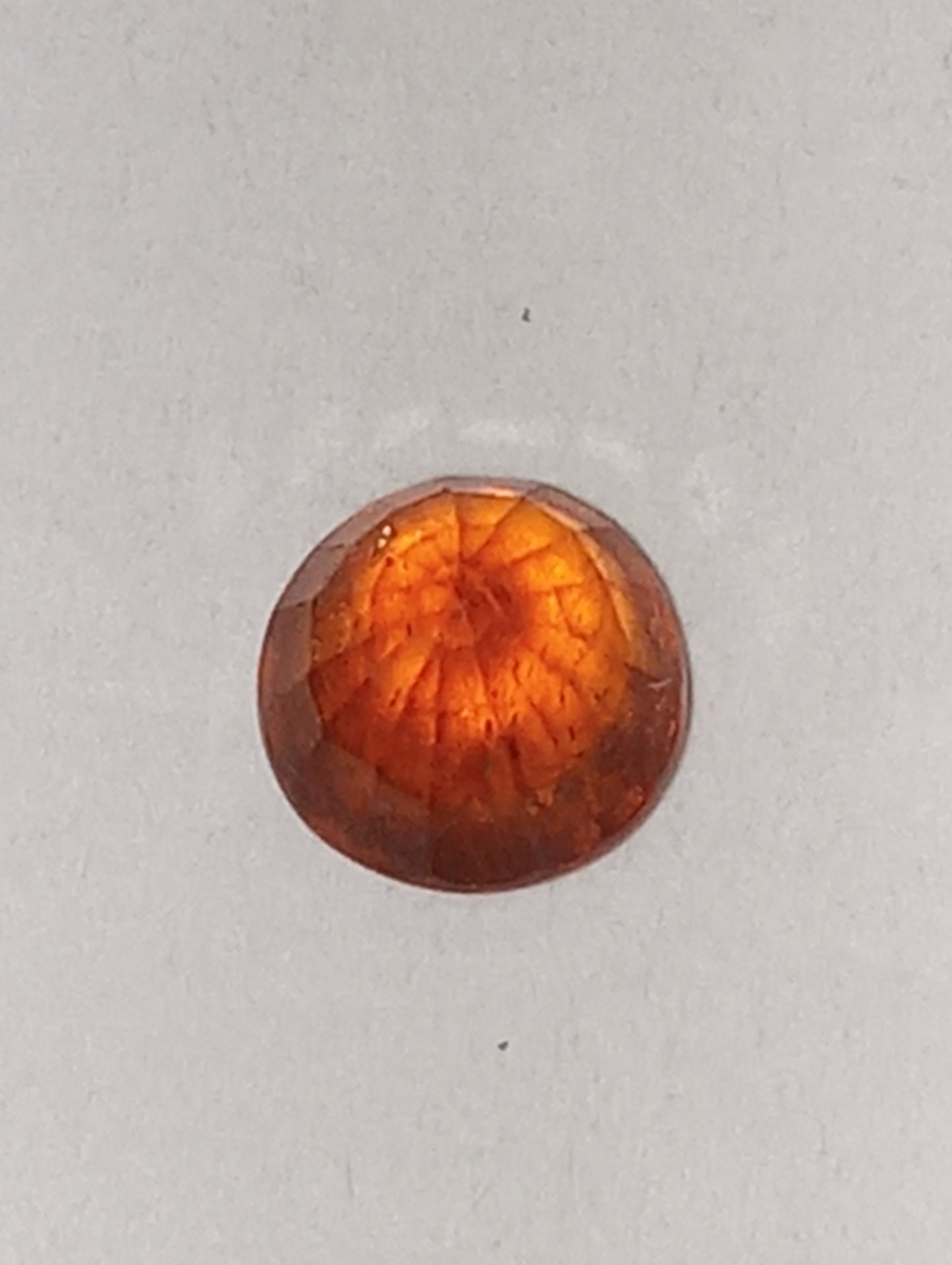 garnet gemstone Mandarin spessartite, 5mm round cut, .68ct