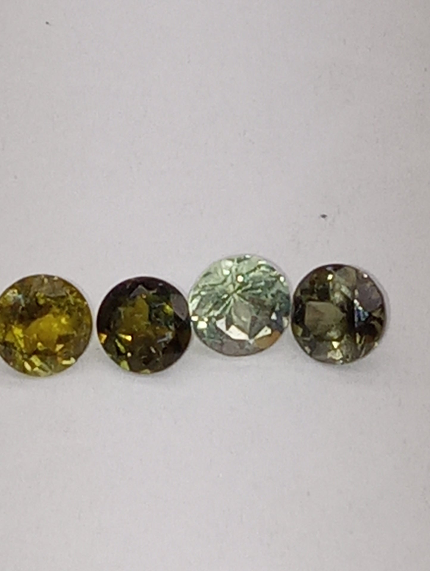 tourmaline gemstones, green shades, 5mm round cuts, 4 stones, 2.20ctw