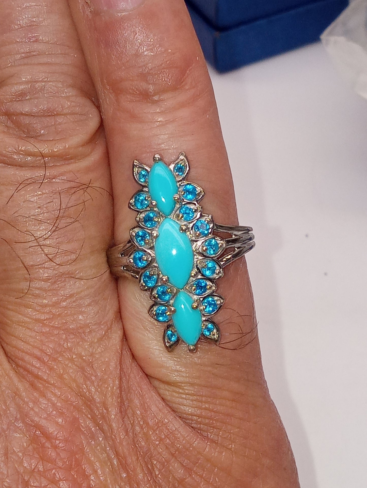 ring Sleeping Beauty turquoise, elongated floral in platinum over sterling silver, sioze 8, 2.50ctw