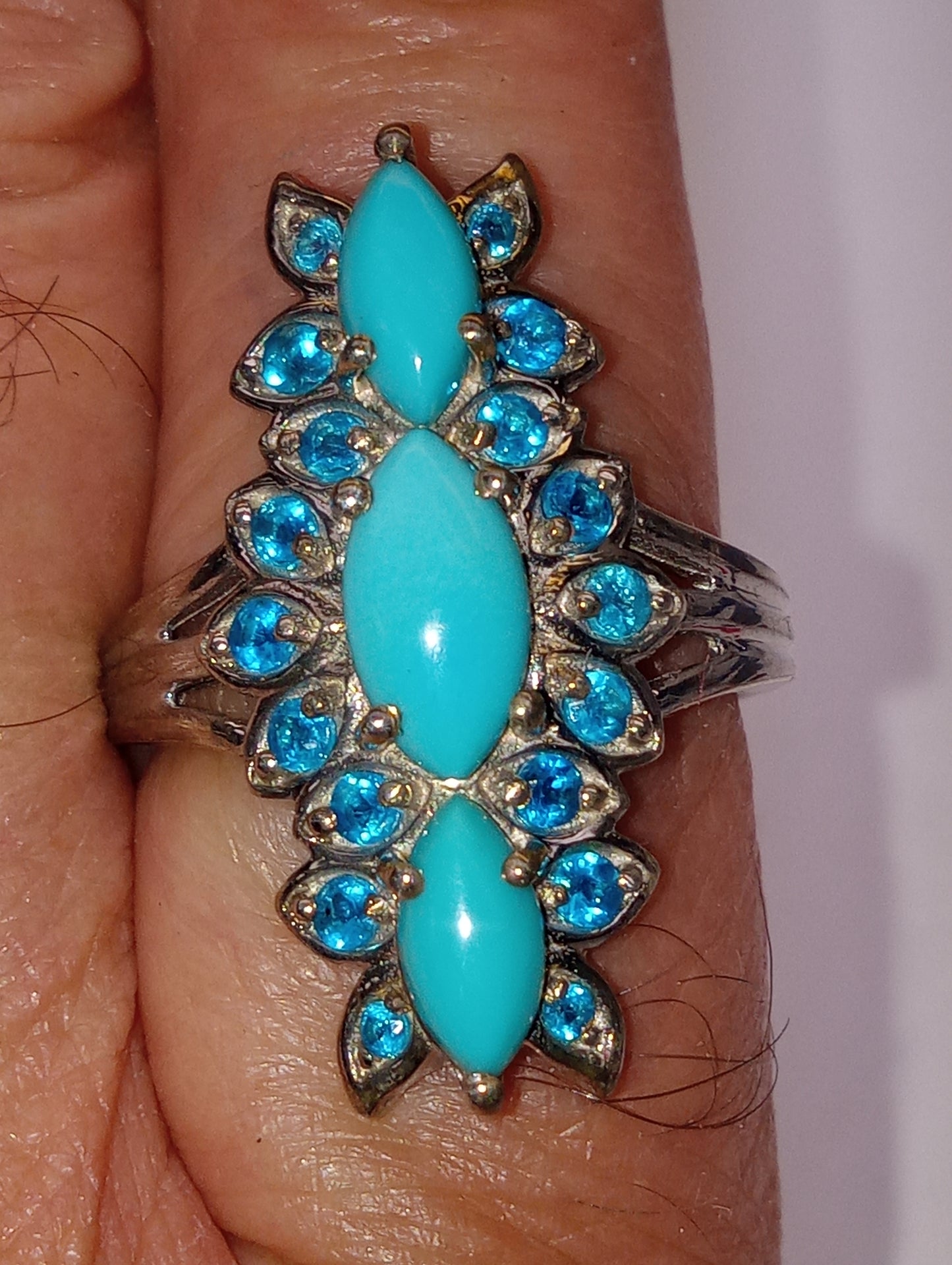 ring Sleeping Beauty turquoise, elongated floral in platinum over sterling silver, sioze 8, 2.50ctw