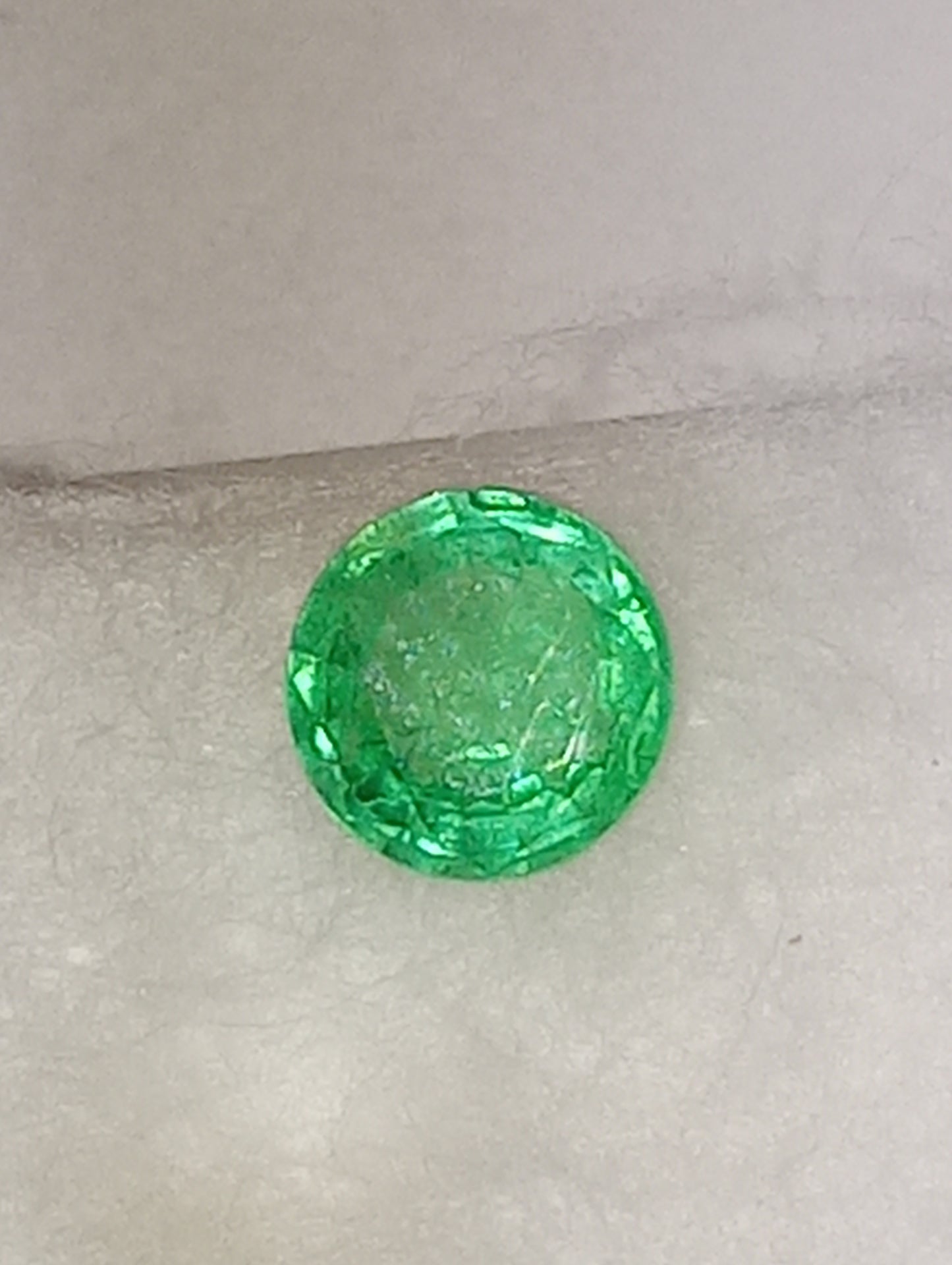 emerald gemstone Nigerian, 5.5mm round cut, .60ct