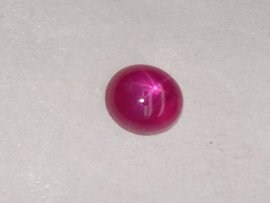 ruby gemstone Burma star, 5mmx4mm oval cabocon, .79ct