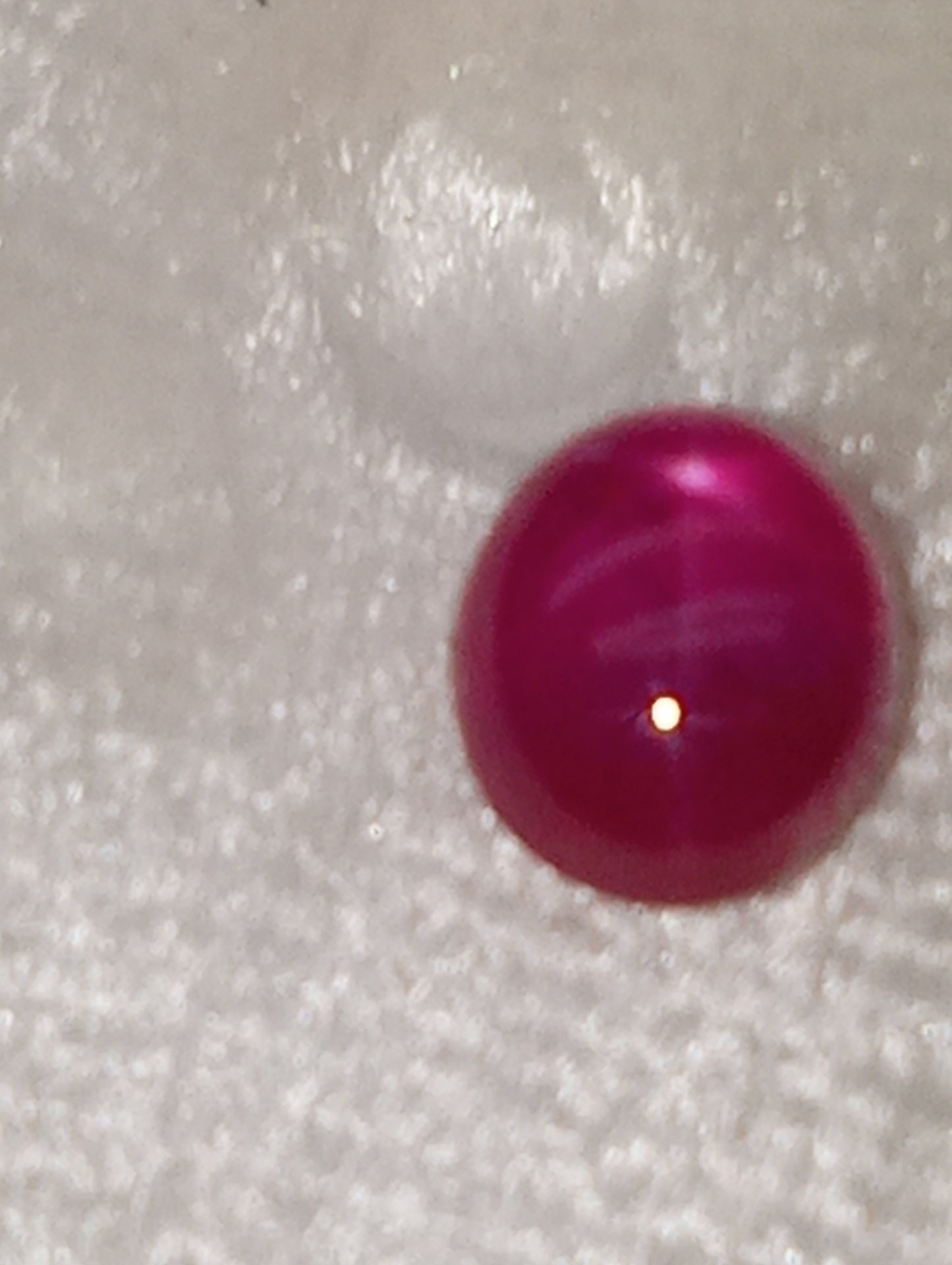 ruby gemstone Burma star, 5mmx4mm oval cabocon, .79ct