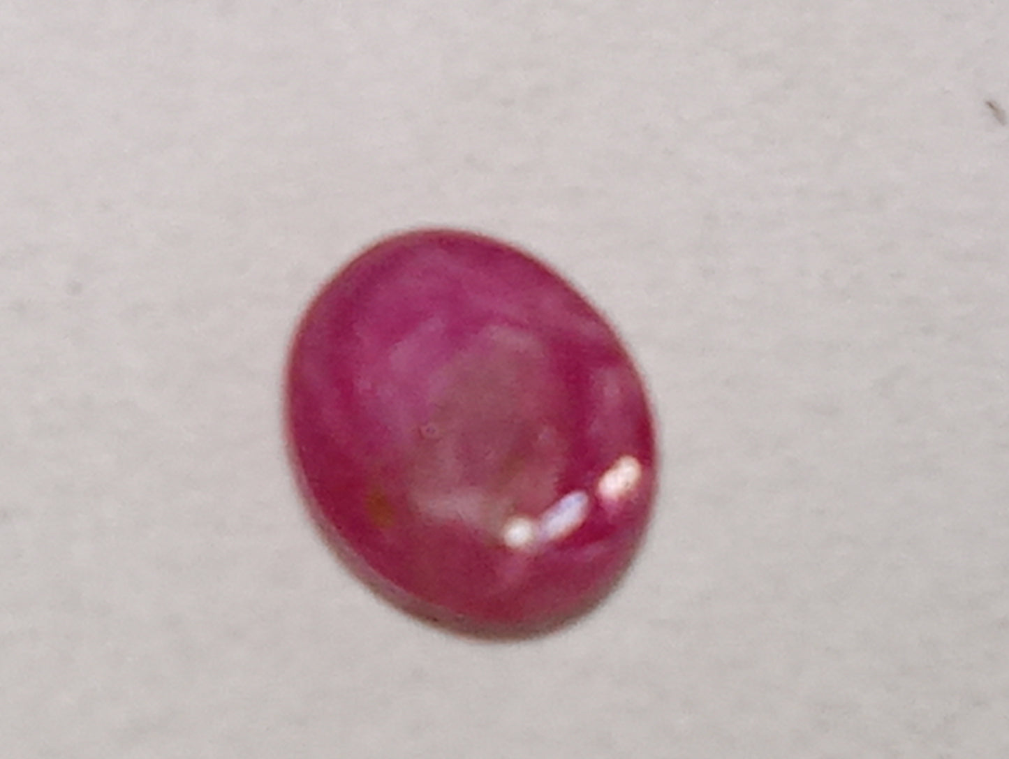ruby gemstone Burma star, 5mmx4mm oval cabocon, .79ct