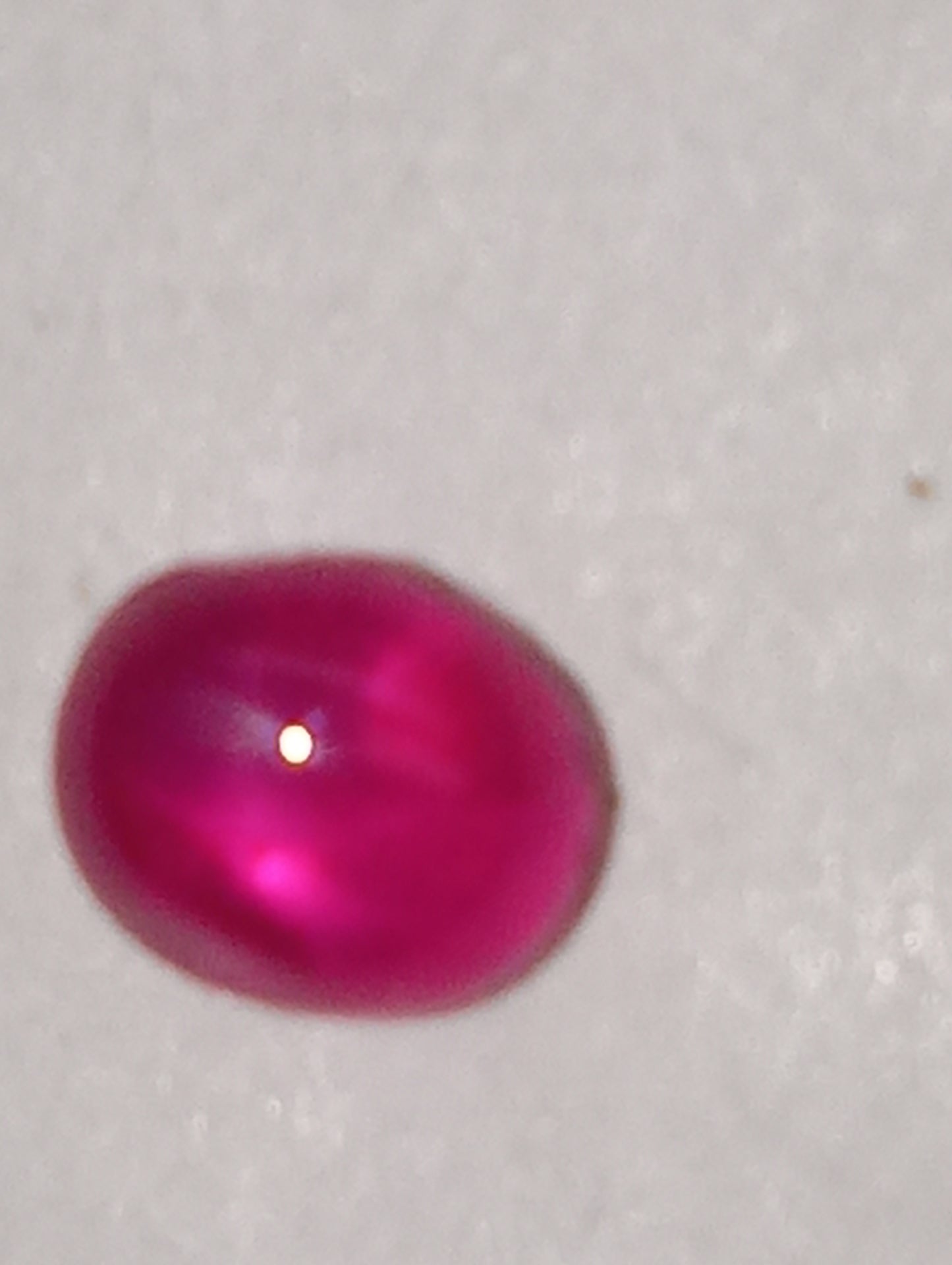 ruby gemstone Burma star, 4.75mmx3.5mm cabocon oval, .84ct