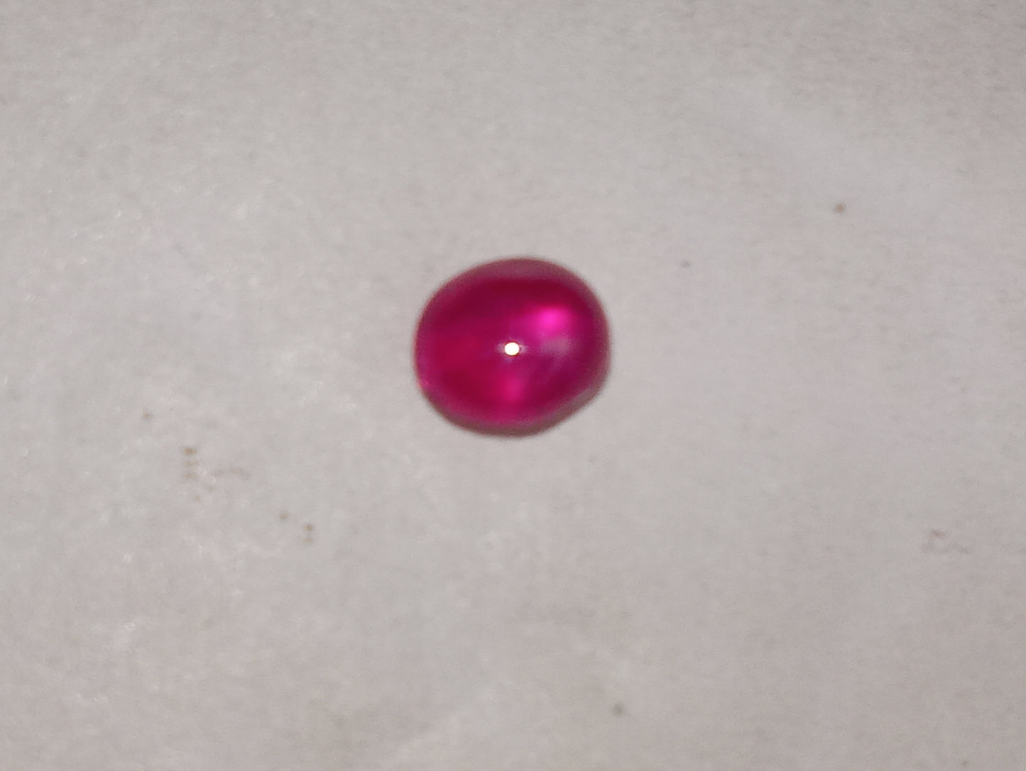 ruby gemstone Burma star, 4.75mmx3.5mm cabocon oval, .84ct