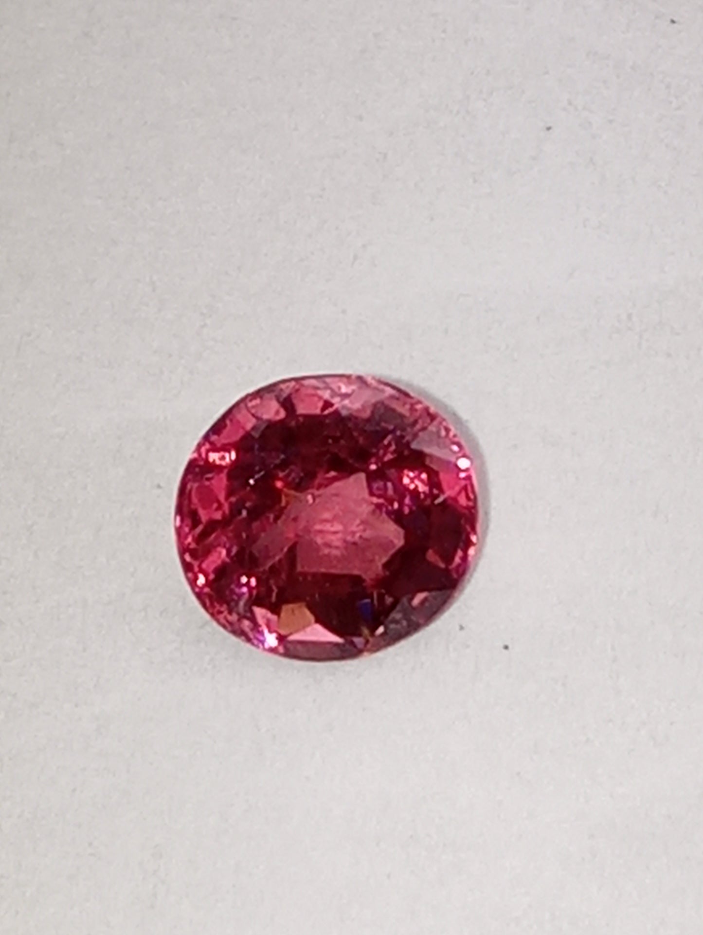 spinel gemstone Burmese, orangey red, 6mmx5.5mm oval cut, .79ct