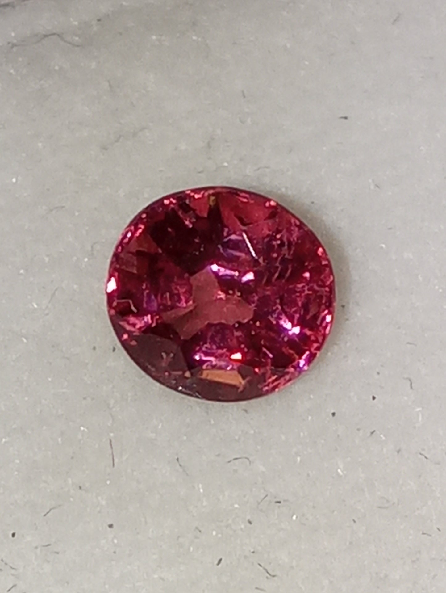 spinel gemstone Burmese, orangey red, 6mmx5.5mm oval cut, .79ct