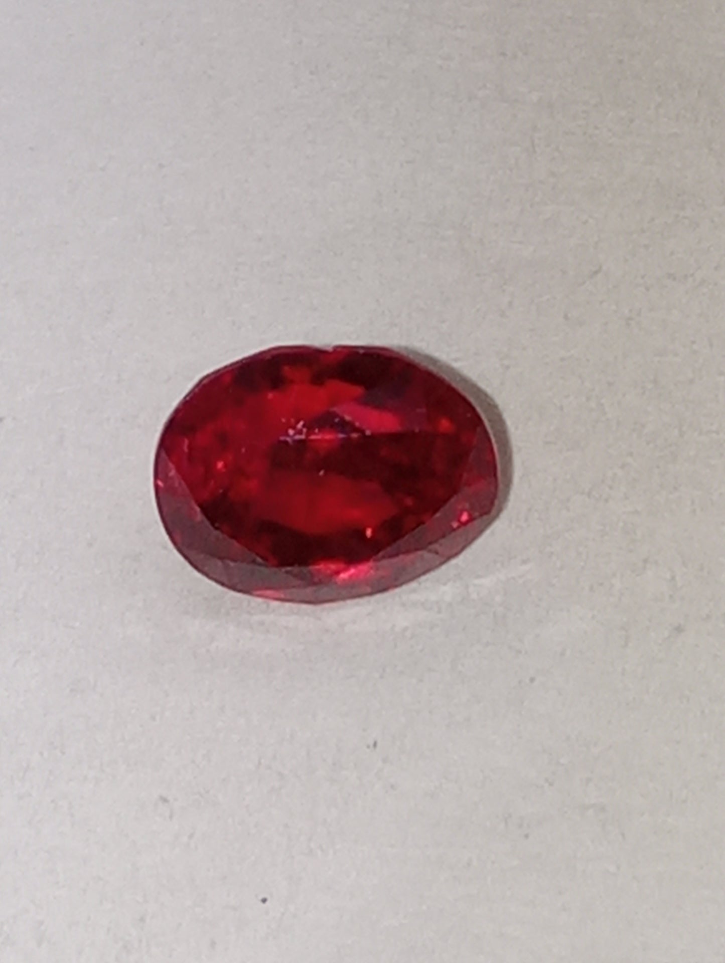 spinel gemstone, flame red, 6.25mmx5mm oval cut, 1.21ct