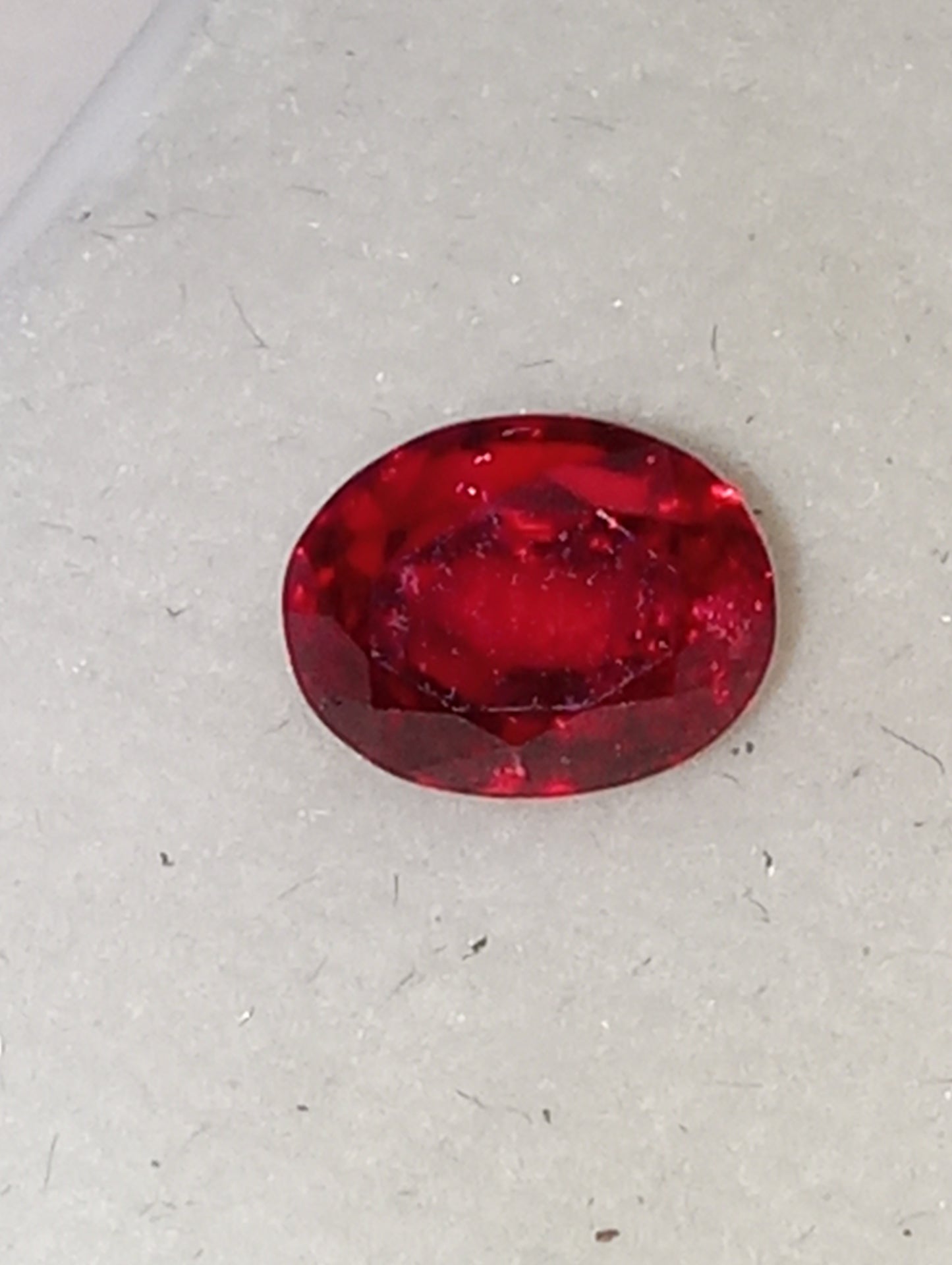 spinel gemstone, flame red, 6.25mmx5mm oval cut, 1.21ct