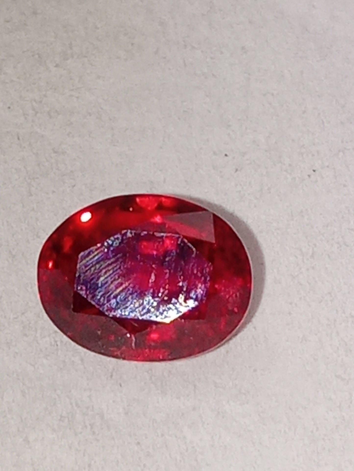 spinel gemstone, flame red, 6.25mmx5mm oval cut, 1.21ct
