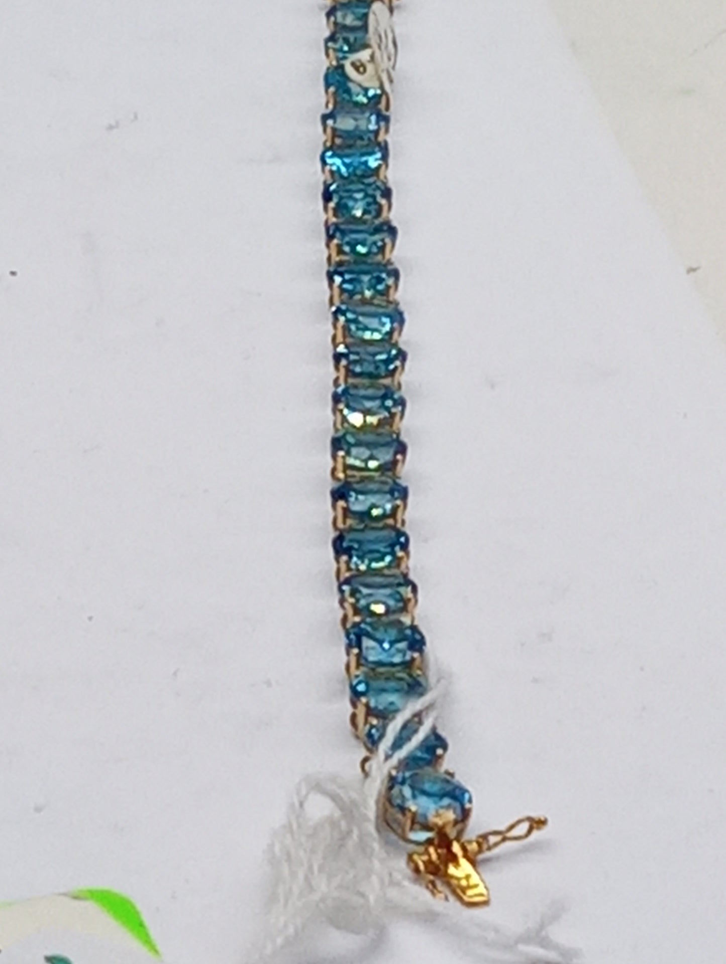 bracelet Swiss blue topaz rounds in 10k yellow gold, 48ctw