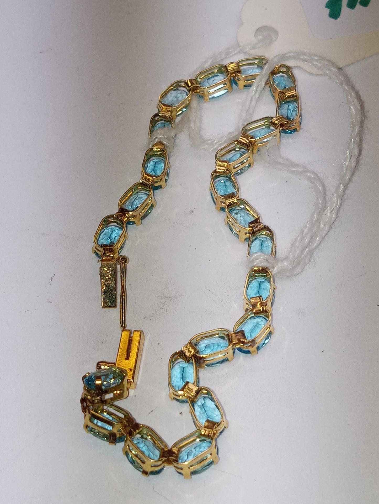 bracelet Swiss blue topaz 6mmx4mm ovals in 14k yellow gold
