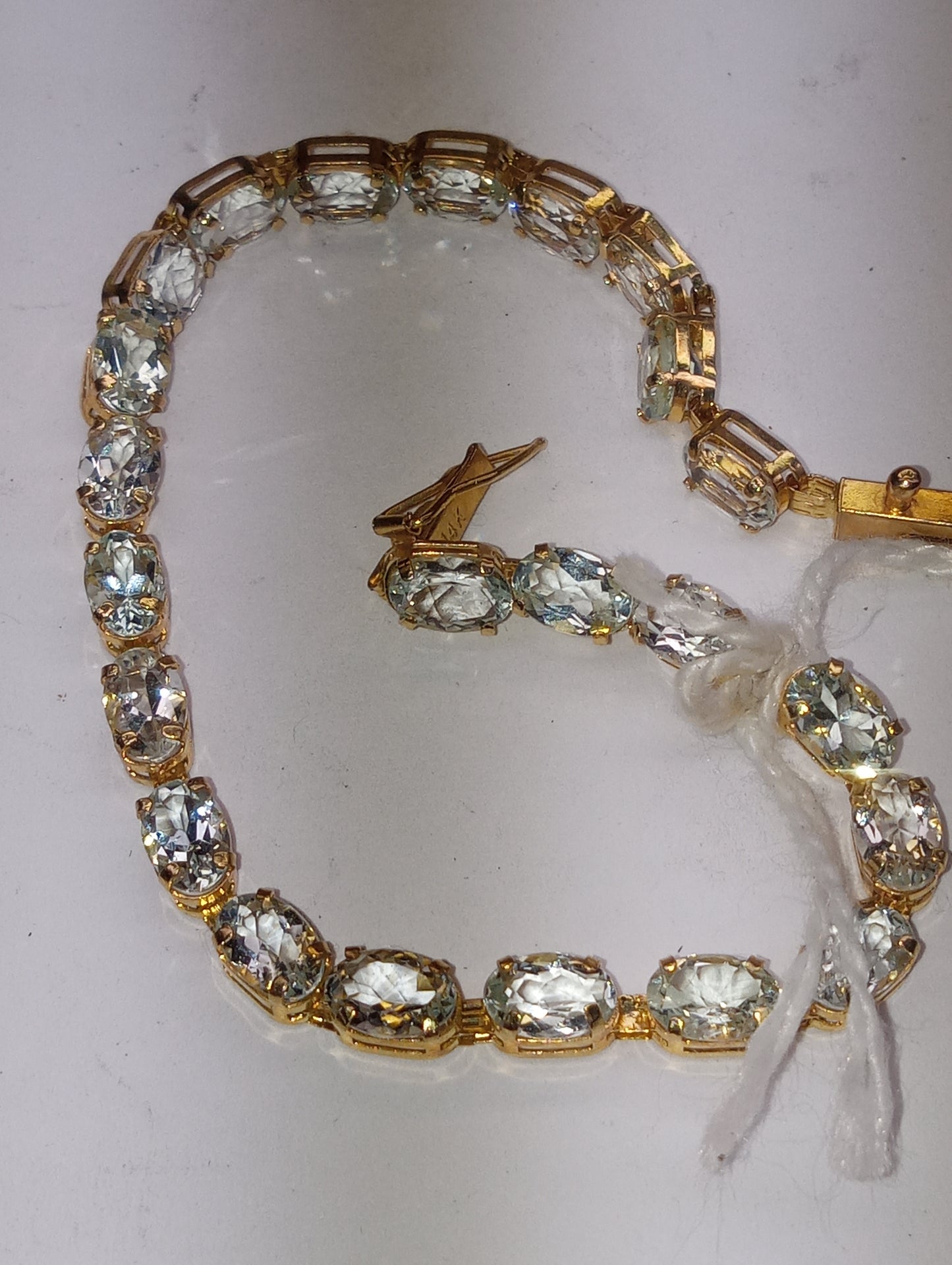 bracelet light aquamarine in 14k yellow gold, 6mmx4mm oval cut stones