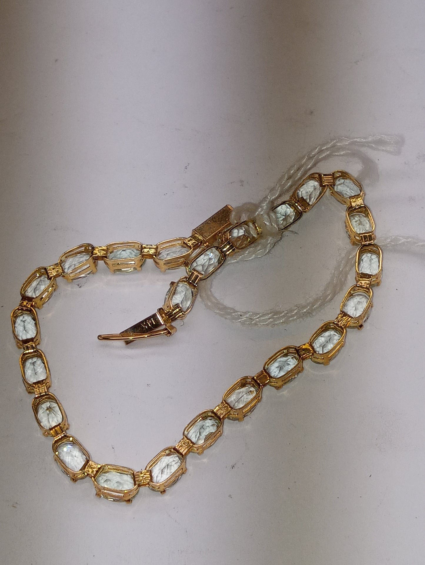 bracelet light aquamarine in 14k yellow gold, 6mmx4mm oval cut stones