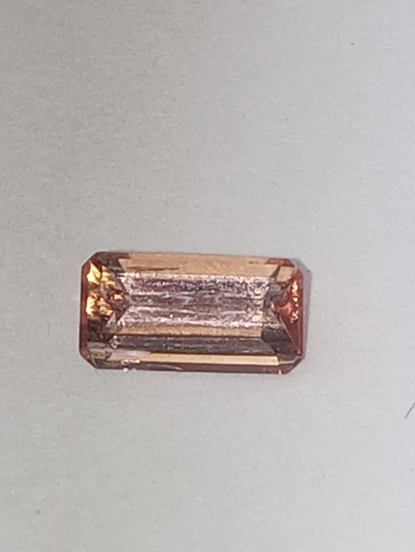 topaz gemstone Imperial, peachy pink,  7mmx4mm bagette cut, .81ct