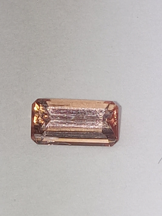 topaz gemstone Imperial, peachy pink,  7mmx4mm bagette cut, .81ct