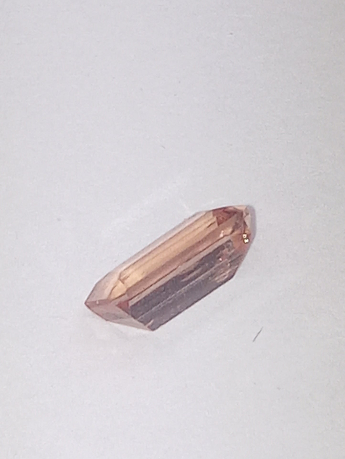 topaz gemstone Imperial, peachy pink,  7mmx4mm bagette cut, .81ct
