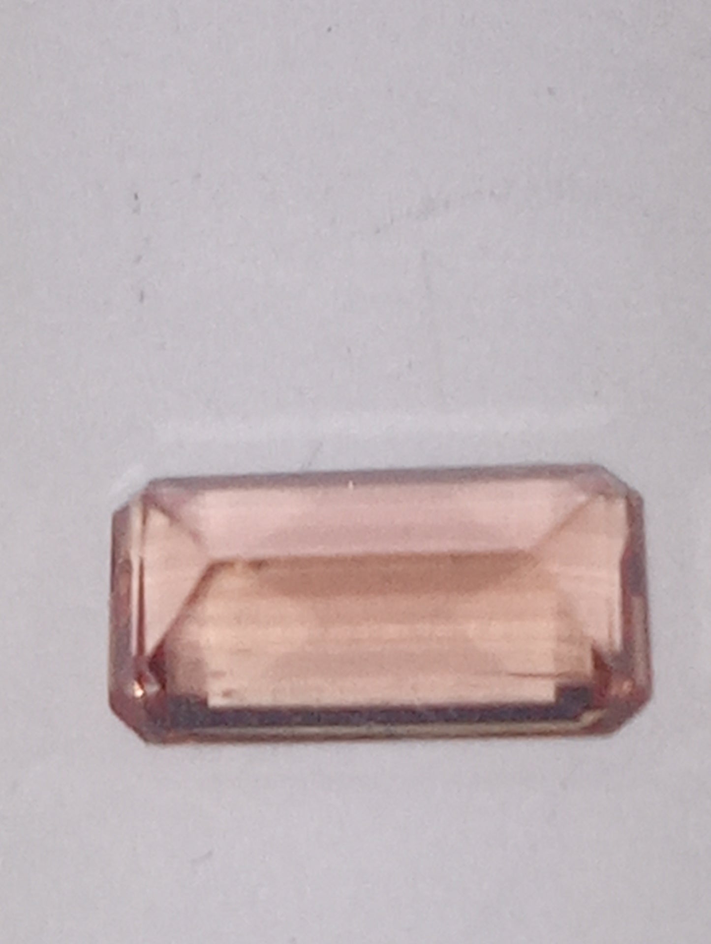 topaz gemstone Imperial, peachy pink,  7mmx4mm bagette cut, .81ct